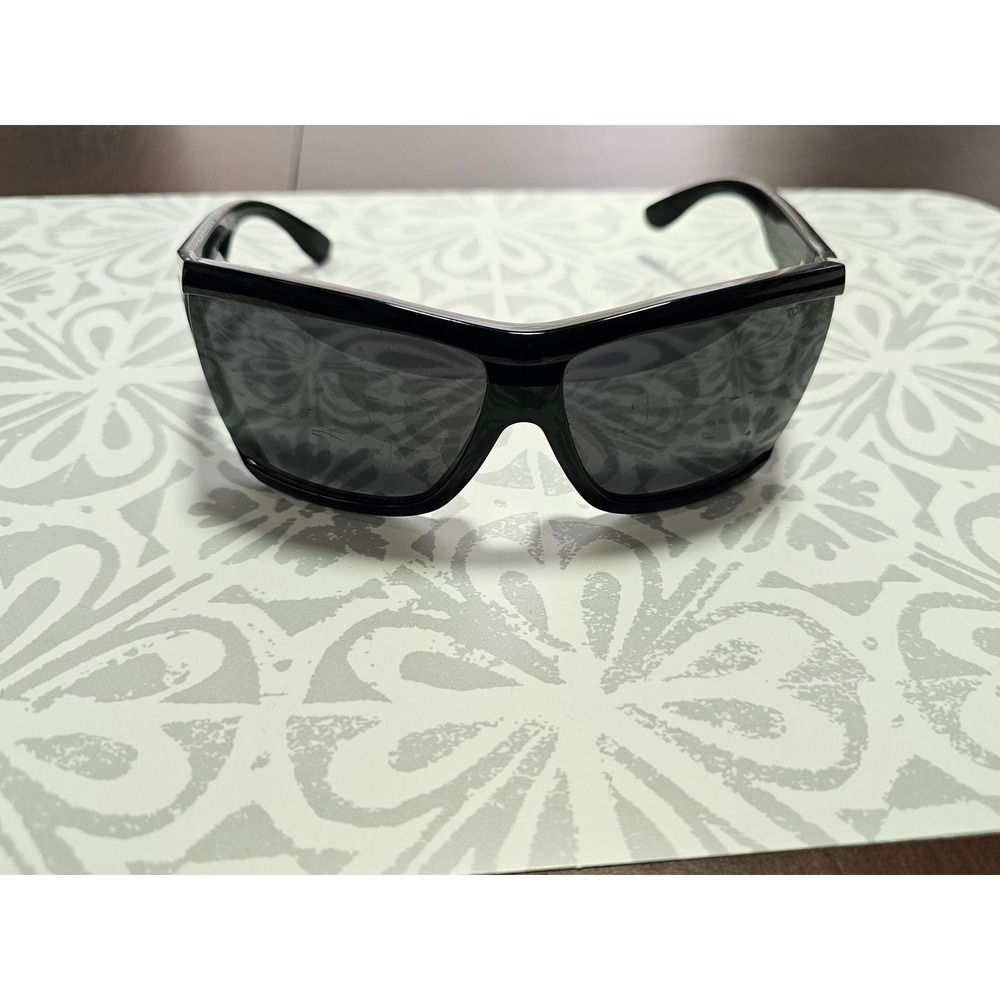 black Tom Ford Sedgewick wrap sunglasses with a gold T logo on the temple.